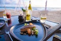 Grilled Salmon, Dinner during sunset on the beach in Phuket Thailand Royalty Free Stock Photo