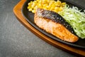 Grilled salmon fillet steak on hot plate Royalty Free Stock Photo