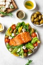 Grilled salmon fish fillet and greek salad Royalty Free Stock Photo