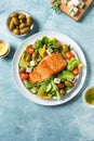 Grilled salmon fish fillet and greek salad Royalty Free Stock Photo