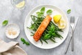 Grilled salmon fish fillet and green beans with lemon and basil Royalty Free Stock Photo