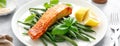 Grilled salmon fish fillet and green beans with lemon and basil. Banner Royalty Free Stock Photo