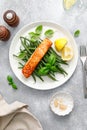 Grilled salmon fish fillet and green beans with lemon and basil Royalty Free Stock Photo