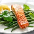 Grilled salmon fish fillet and green beans with lemon and basil Royalty Free Stock Photo