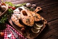 Grilled salmon fish with seasoning and various vegetables Royalty Free Stock Photo