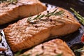 Grilled salmon fish with various vegetables on pan Royalty Free Stock Photo