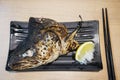 Grilled salmon head on the plate Royalty Free Stock Photo