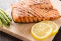 Grilled salmon and lemon, asparagus, on the wooden table Royalty Free Stock Photo