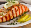 Grilled Salmon with lemon, olives and thyme Royalty Free Stock Photo