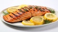 Grilled salmon with lemon on a plate isolated on white background Royalty Free Stock Photo