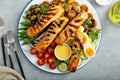 Grilled salmon nicoise salad with fresh vegetables and eggs Royalty Free Stock Photo