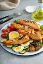 Grilled salmon Nicoise salad Royalty Free Stock Photo