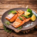 Grilled salmon with olives and lemon on a plate. Royalty Free Stock Photo