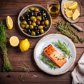 Grilled salmon with olives and lemon on white plate. Royalty Free Stock Photo