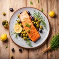 Grilled salmon with olives and lemon on white plate. Royalty Free Stock Photo
