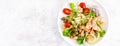 Grilled salmon salad with fresh lettuce, tomatoes, green olives, red onion and pasta. Healthy food, diet. Top view. Banner Royalty Free Stock Photo