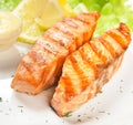 Grilled salmon, salad on plate Royalty Free Stock Photo