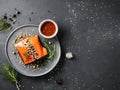 Delicious grilled salmon served with a flavorful sauce. Royalty Free Stock Photo