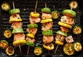 Grilled salmon skewers with zucchini and herb marinade in a grill pan