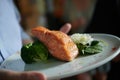 Grilled salmon slice on a bed of fresh spinach leaves and blanched broccoli Royalty Free Stock Photo