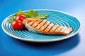 grilled salmon steak with distinct mark lines on a blue dish Royalty Free Stock Photo