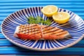 grilled salmon steak with distinct mark lines on a blue dish Royalty Free Stock Photo