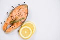 Grilled salmon steak with herbs and spices rosemary lemon on plate background Close up cooked salmon fish fillet steak seafood Royalty Free Stock Photo