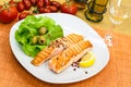 Grilled salmon steak with lettuce Royalty Free Stock Photo