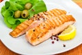 Grilled salmon steak with lettuce Royalty Free Stock Photo