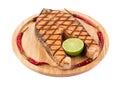 Grilled salmon steak on platter. Royalty Free Stock Photo