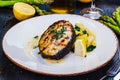 Grilled salmon steak with potato and spinach on white plate Royalty Free Stock Photo