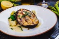 Grilled salmon steak with potato and spinach on white plate Royalty Free Stock Photo