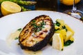 Grilled salmon steak with potato and spinach on white plate Royalty Free Stock Photo