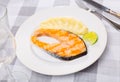 Grilled salmon steak served on plate with mashed potatoes