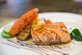 Grilled salmon steak and vegetables in white dish at Japanese food restaurant. Royalty Free Stock Photo