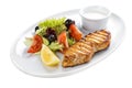 Grilled salmon steak with vegetables. On a white plate Royalty Free Stock Photo