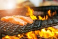 Grilled salmon steaks on a grill. Fire flame grill. Restaurant and garden kitchen. Garden party. Healthy dish. Royalty Free Stock Photo