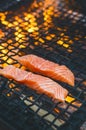 Grilled salmon steaks on a grill. Fire flame grill. Restaurant and garden kitchen. Garden party. Healthy dish. Royalty Free Stock Photo