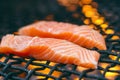 Grilled salmon steaks on a grill. Fire flame grill. Restaurant and garden kitchen. Garden party. Healthy dish. Royalty Free Stock Photo