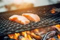 Grilled salmon steaks on a grill. Fire flame grill. Restaurant and garden kitchen. Garden party. Healthy dish. Royalty Free Stock Photo