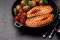 Grilled salmon steaks and potatoes in a frying pan Royalty Free Stock Photo