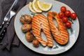 Grilled salmon steaks and potatoes