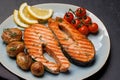 Grilled salmon steaks and potatoes Royalty Free Stock Photo