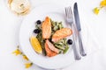 Grilled salmon with steamed green beans and lemon