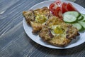 Grilled sandwich with egg, vegetables and bacon on a dark wooden background. Tasty breakfast Royalty Free Stock Photo