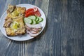 Grilled sandwich with egg, vegetables and bacon on a dark wooden background. Tasty breakfast.Place for text Royalty Free Stock Photo