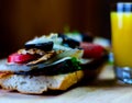 Grilled sandwich with various cold meats, cheese, mushrooms, tom Royalty Free Stock Photo