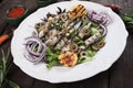 Grilled sardine fish with lettuce and olives Royalty Free Stock Photo