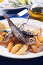 Grilled sardine fish with potato wedges Royalty Free Stock Photo