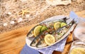 Grilled sardines on a platter outdoors Royalty Free Stock Photo